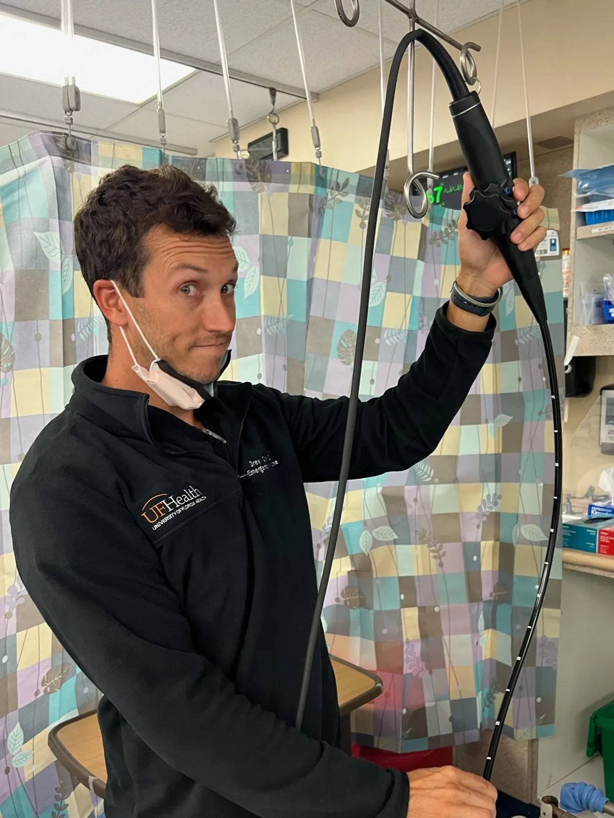 Faculty demonstrating the TEE probe in the ED