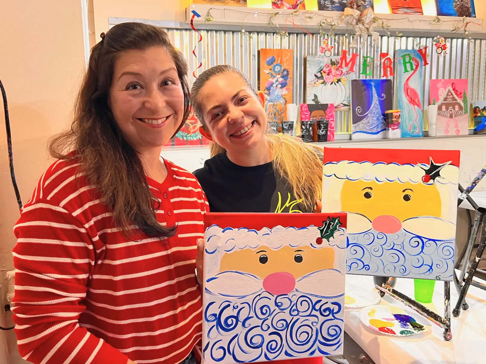 Faculty and fellows at a paint-night program social